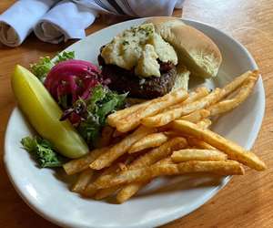 Burger with blue cheese and french fries. 